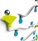 The Gecko Run: Marble Run kit features colorful, interconnected tracks and a shiny marble rolling down a green funnel. The setup includes various curves and loops, promoting creativity and engineering skills as users create their own marble run designs.