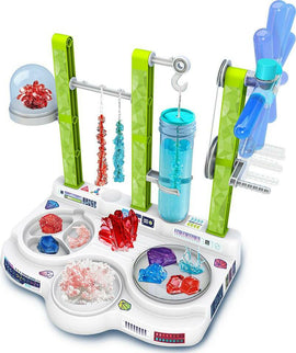 The Ooze Labs: Colorful Crystal Lab DIY kit by Thames & Kosmos features a vibrant setup with various colorful crystals displayed on a laboratory-style base. The kit includes beakers, a rotating mechanism, and hooks for hanging crystal formations, inviting hands-on experimentation and creativity.
