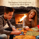 A boy and a girl engage in the Exit: The Magical Academy escape room game, seated around a wooden table with game materials. The boy, smiling and focused, writes on a game card, while the girl points at a game board, both immersed in the challenge. A cozy fireplace glows in the background, adding warmth to the family-friendly atmosphere.