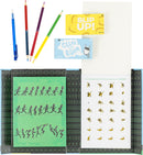 The Flip Book Kit by Tiger Tribe features a flip book with illustrated stick figures in motion on a green background, colorful pencils, and two small game cards: 'Slip Up!' and 'Clear the Room'. The kit promotes creativity and fun, making it suitable for both kids and adults.