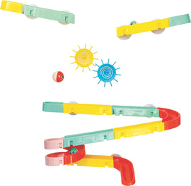 A colorful Waterslide Marble Run by Tiger Tribe, featuring multi-colored tracks in green, yellow, and red, along with playful sun-shaped accessories. The design allows for marbles to glide smoothly, creating an engaging and interactive experience for children.