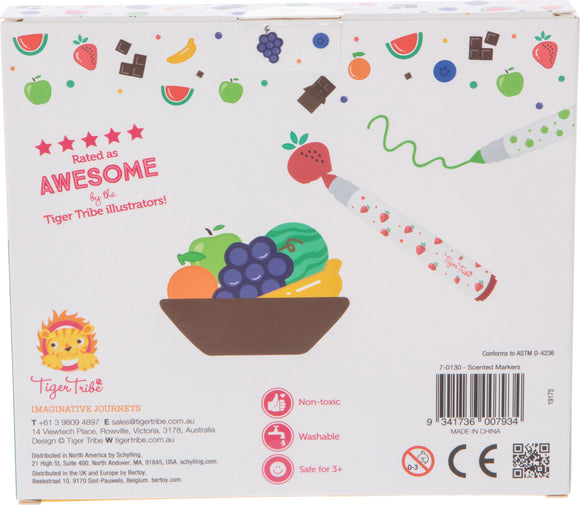 Packaging for Tiger Tribe Scented Markers featuring colorful illustrations of fruits and candies. The front shows a bowl of fruit with two markers, one red with a strawberry tip and one green, highlighted as non-toxic, washable, and suitable for children aged 3 and up.