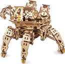 The Ugears 3D Hexapod Explorer is a detailed DIY mechanical kit made from precision-cut plywood. It features six articulated legs for realistic movement, with a complex structure showcasing gears and components, allowing users to engage in creative assembly and interactive play. The model is designed to resemble a spider-like creature and offers an educational experience in engineering and mechanics.