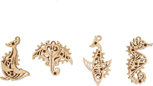 A collection of four intricately designed wooden fidget toys from Ugears, shaped like sea creatures. The designs showcase unique, mechanical patterns etched into the wood, featuring various poses of seahorses and other oceanic elements. Ideal for stress relief, these toys are both aesthetically pleasing and functional, making them a perfect addition to any desk or collection.