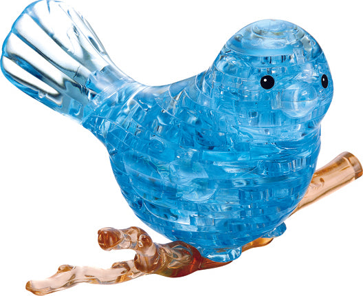 A beautifully crafted 3D crystal jigsaw puzzle of a vibrant blue bird perched on a branch. The bird features intricate detailing, translucent blue pieces, and charming round eyes, making it an eye-catching decorative item.