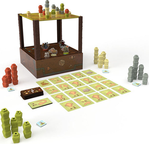 Mountains Out of Molehills game by USAopoly featuring a multi-layered game tower filled with various colorful building tokens. Surrounding the tower are game cards, player pieces, and stacks of tokens in different colors, ready for players to build and strategize.