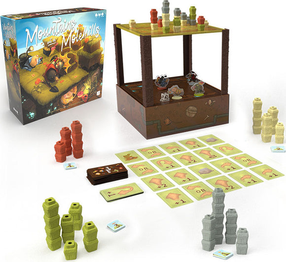The game 'Mountains Out of Molehills' by USAopoly displayed with its components. The box features colorful artwork with a whimsical theme. Surrounding it are various game pieces including stacks of colored blocks and cards laid out on a surface, which includes challenge cards and scoring elements. The game's playful design invites players to engage in creative problem-solving and strategy.