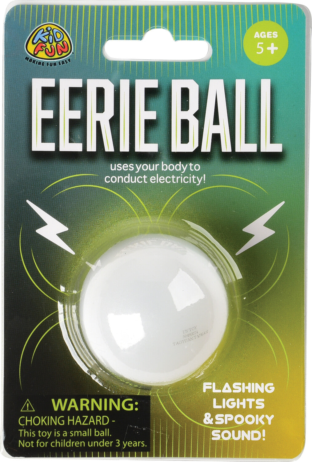 The Eerie Ball by U.S. Toy is a small, white ball displayed on a vibrant green and black package. The packaging features text stating that it uses your body to conduct electricity, along with icons indicating flashing lights and spooky sounds. A warning label is present, noting that it's a choking hazard for children under three years old.