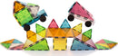 The Grand Prix Magna Tiles set consists of 50 colorful, translucent geometric pieces in various shapes including triangles, squares, and rectangles. The tiles are arranged to create a playful scene featuring two toy cars and a vibrant structure made from the pieces, showcasing the endless possibilities of creativity and construction.