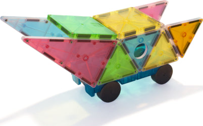 Grand Prix Magna Tiles 50-piece DIY kit featuring colorful transparent magnetic tiles. The construction resembles a vibrant, multi-colored vehicle with wheels, showcasing creativity and play.