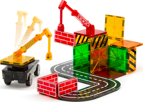 Magna Tiles Builder 32 Piece Set featuring colorful translucent building tiles and construction pieces. Includes a truck base with a moving crane, road tracks, and various building structures to inspire creativity and engineering skills.