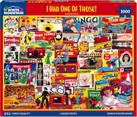 Colorful jigsaw puzzle box featuring the title 'I Had One of Those!' by Charlie Girard. The cover shows a collage of vintage toys and games, including bingo, dolls, and other nostalgic items, all set against a vibrant red background. The puzzle consists of 1000 pieces and promises an enjoyable challenge for fans of retro memorabilia.
