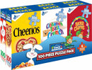 A colorful jigsaw puzzle pack containing six 100-piece puzzles featuring classic cereal brands: Cheerios, Cinnamon Toast Crunch, and Lucky Charms. The packaging is vibrant, showcasing fun and playful graphics of the cereal mascots and logos, designed for puzzle enthusiasts and cereal lovers.