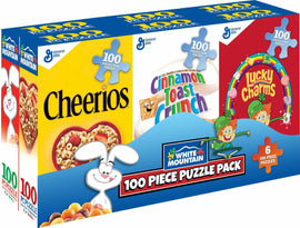 A colorful jigsaw puzzle pack containing six 100-piece puzzles featuring classic cereal brands: Cheerios, Cinnamon Toast Crunch, and Lucky Charms. The packaging is vibrant, showcasing fun and playful graphics of the cereal mascots and logos, designed for puzzle enthusiasts and cereal lovers.