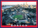 A vibrant jigsaw puzzle featuring an aerial view of Fenway Park in Boston at sunset. The image showcases the iconic baseball stadium filled with fans, surrounded by the cityscape and the Charles River, framed in a red and blue design that highlights the Boston theme.