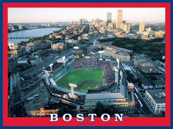 A vibrant jigsaw puzzle featuring an aerial view of Fenway Park in Boston at sunset. The image showcases the iconic baseball stadium filled with fans, surrounded by the cityscape and the Charles River, framed in a red and blue design that highlights the Boston theme.