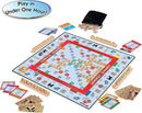 Monopoly Scrabble game by Winning Moves, featuring a colorful game board with a mix of Monopoly and Scrabble elements. Players can enjoy building words while acquiring properties, with game tokens, cards, and letter tiles scattered around. A black bag contains additional tiles. The game promotes fun for families and friends, playable in under one hour.