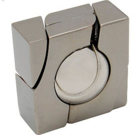 Hanayama Cast Marble mechanical puzzle featuring a sleek, metallic design. The puzzle consists of four pieces surrounding a circular center piece that showcases a shiny, reflective surface. Ideal for enthusiasts of brain teasers and tactile challenges.