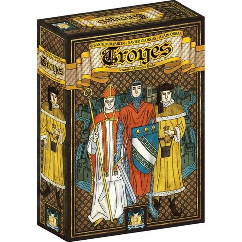 The 'Troyes' game by Asmodee, featuring an illustrated box depicting three medieval characters: a bishop in a red mitre, a nobleman in a blue outfit, and a man in a yellow cloak. The background showcases a stylized depiction of medieval architecture and a castle, indicating the historical theme of the game.