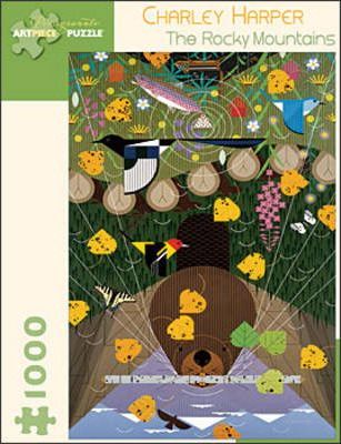 Jigsaw puzzle titled 'The Rocky Mountains' by Charley Harper, featuring vibrant artwork of wildlife and nature. The image includes a bear, various colorful flowers, and trees, with a playful and whimsical style. It's a 1000-piece puzzle by Pomegranate, perfect for nature lovers and puzzle enthusiasts.