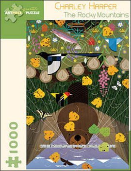 Jigsaw puzzle titled 'The Rocky Mountains' by Charley Harper, featuring vibrant artwork of wildlife and nature. The image includes a bear, various colorful flowers, and trees, with a playful and whimsical style. It's a 1000-piece puzzle by Pomegranate, perfect for nature lovers and puzzle enthusiasts.