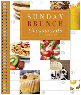 Cover of the 'Sunday Brunch Crosswords' book edited by Leslie Billig, featuring a spiral binding and a collage of brunch foods such as pancakes, muffins, fruits, and coffee, set against a calendar background.