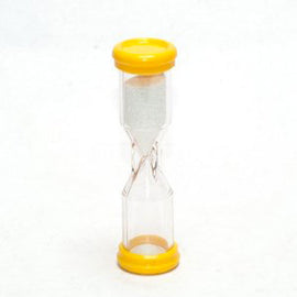 A clear sand timer featuring a yellow top and bottom, designed to measure three minutes. The sand flows through a narrow passage in the center, showcasing a simple yet effective design suitable for various games.
