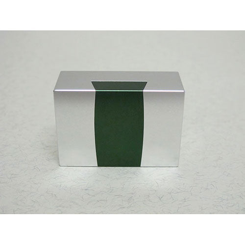 The Aluminum Dovetail Convex by W.G.H. Strijbos is a sleek mechanical puzzle featuring a minimalist design in silver and green tones. Its geometric shape highlights the precision of aluminum craftsmanship, making it an intriguing challenge for puzzle enthusiasts.