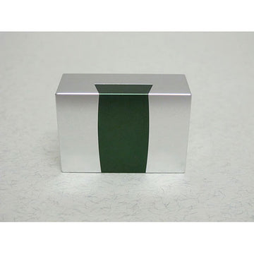 The Aluminum Dovetail Convex by W.G.H. Strijbos is a sleek mechanical puzzle featuring a minimalist design in silver and green tones. Its geometric shape highlights the precision of aluminum craftsmanship, making it an intriguing challenge for puzzle enthusiasts.
