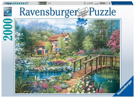 The 'Shades of Summer' jigsaw puzzle by Ravensburger features a vibrant, picturesque scene of a charming house surrounded by a lush garden filled with colorful flowers and a serene stream with a wooden bridge. The artwork is designed with intricate details and rich colors, capturing the essence of summer tranquility. This 2000-piece jigsaw puzzle is perfect for puzzle enthusiasts and nature lovers.