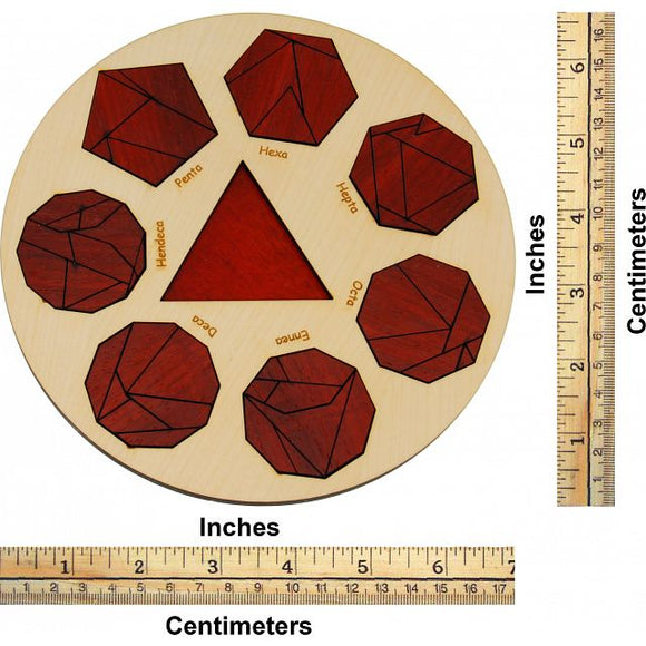 A circular wooden mechanical puzzle called Mathekreis, designed by Jean-Claude Constantin. The puzzle features eight distinct geometric shapes: a tetrahedron, pentagon, hexagon, heptahedron, octahedron, dodecahedron, and icosahedron. The shapes are outlined in black against a reddish-brown background, with each shape labeled. A triangular cutout is in the center. A measuring ruler in both inches and centimeters is placed alongside for scale.