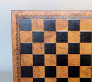 13-inch leather chessboard featuring a vintage old map design. The board alternates between rich brown and black squares, framed by an ornate border. Perfect for chess enthusiasts and collectors.