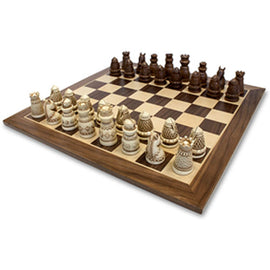 A beautifully crafted medieval chess set featuring a 2 1/2 inch king piece. The set includes intricately designed chess pieces in dark and light tones, positioned on a classic checkered board. The craftsmanship showcases a historical theme, perfect for enthusiasts and collectors.