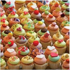 A vibrant collection of assorted cupcakes featuring various colors and decorative toppings, including sprinkles, candies, and icing designs, showcasing a festive and appealing display perfect for a creative jigsaw puzzle theme.