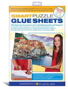 Individual Smart Puzzle Glue Sheets by Eurographics, designed to preserve and display your completed jigsaw puzzle with ease. The packaging features a young girl demonstrating the application of the glue sheets on a colorful puzzle image with a scenic view. Includes hangers for easy mounting, with a clear message highlighting the simplicity and mess-free application without traditional glue or complicated framing.