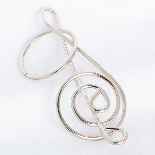 The G-Clef Puzzle by Eureka Puzzles is a unique mechanical puzzle designed in the shape of a treble clef. Made of durable metal, it features intricate loops and curves, inviting users to engage in a challenging experience as they work to untangle its structure. Ideal for music lovers and puzzle enthusiasts, this captivating piece combines artistry with brain-teasing fun.