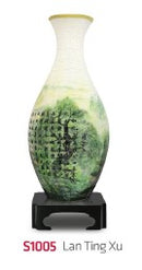 The Lan Ting Xu 3D Jigsaw Puzzle Vase by Pintoo displayed on a sleek black stand. The vase features intricate designs with vibrant green and white colors, resembling a beautifully painted landscape, ideal for puzzle enthusiasts and decor lovers.