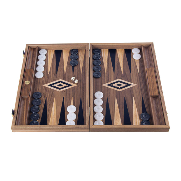 19-inch wooden backgammon set from Manopoulous, featuring a beautifully designed board with a rich wooden finish, alternating light and dark triangles, black and white checkers, and two dice, all set in an elegant carrying case.