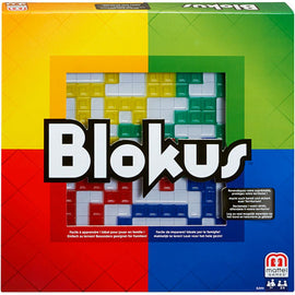 The Blokus board game by Mattel features a colorful square box design with red, yellow, green, and blue sections. The title 'Blokus' is prominently displayed in bold white letters. The background showcases a partially completed game board with various geometric pieces in different colors, indicating a strategic game play environment for families and friends.