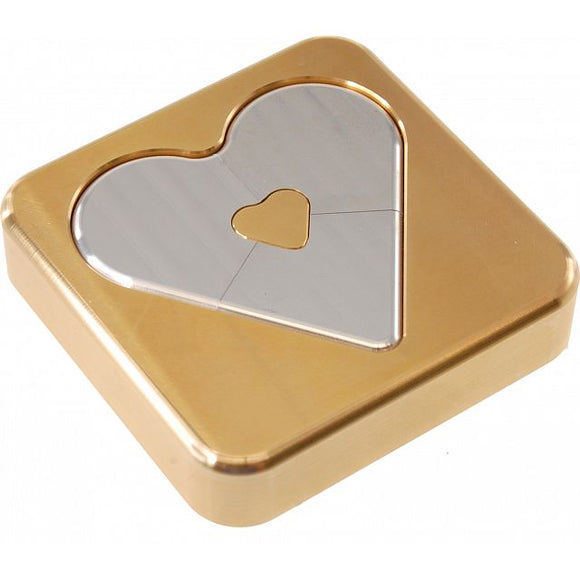 A beautifully crafted aluminum mechanical puzzle featuring a heart shape in a square frame. The heart shape is made of shiny metal, contrasting with the gold-tone surrounding. Perfect for brain teasers and puzzle enthusiasts.