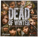 The game box of 'Dead of Winter: A Crossroads Game' designed by Plaid Hat Games, featuring a collage of intense character faces amidst a broken glass design, hinting at the game's survival theme.