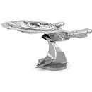 A detailed metal model of the USS Enterprise, featuring intricate design elements and a sleek finish. The model is depicted on a sturdy base, showcasing its iconic starship shape with visible panels and mechanical details, perfect for collectors and DIY enthusiasts.
