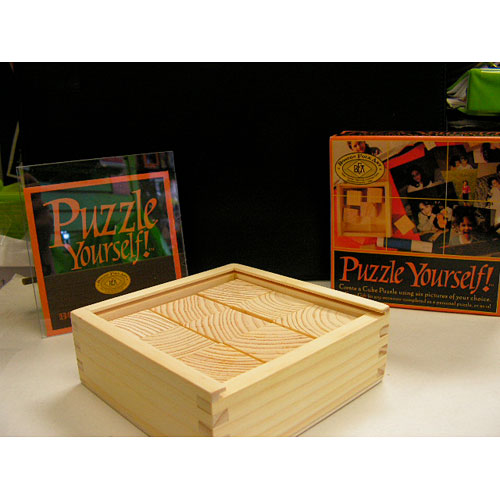 Puzzle Yourself! by Boston Folk Art features a creative DIY kit that allows users to personalize their own wooden jigsaw puzzle. The kit includes a decorative box and instructions for creating a unique puzzle using personal images. Perfect for art lovers and puzzle enthusiasts alike.