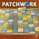 The game Patchwork by Lookout Games features a colorful, quilt-like design with various patterns in shades of blue, green, and yellow. The title 'PATCHWORK' is prominently displayed at the top, alongside the phrase 'For Two Players' at the bottom, emphasizing the game's cooperative playing style. It is designed by renowned game designer Uwe Rosenberg.