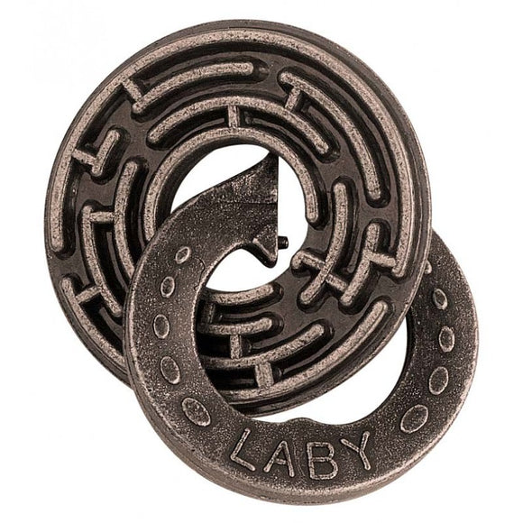 The Cast Labyrinth mechanical puzzle by Hanayama features a circular labyrinth design intricately engraved on a metallic surface. The puzzle is composed of two interlocking pieces that challenge the solver to navigate the maze and separate the parts. Its sleek, dark finish and unique design make it an attractive puzzle for enthusiasts and collectors alike.