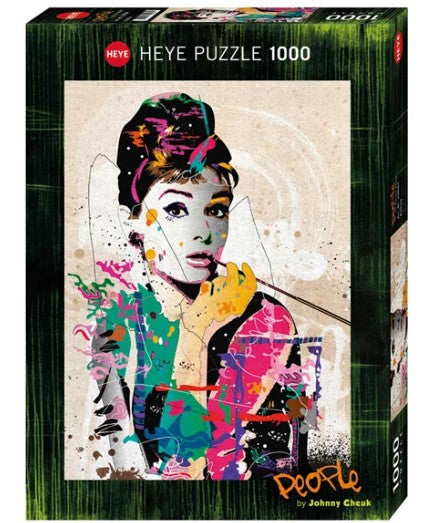 Heye jigsaw puzzle featuring a colorful pop art design of Audrey Hepburn, designed by artist Johnny Cheuk. The puzzle contains 1000 pieces and comes in a vibrant box showcasing the artwork, ideal for puzzle enthusiasts and fans of classic cinema.