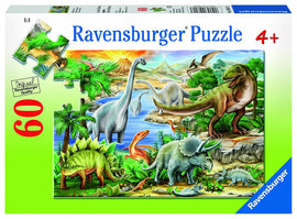 A colorful jigsaw puzzle featuring a prehistoric scene with various dinosaurs in a lush landscape. The puzzle includes 60 pieces, showcasing dinosaurs like the T-Rex, Triceratops, and long-necked Brontosaurus, surrounded by vibrant foliage, water, and mountains, suitable for ages 4 and up.