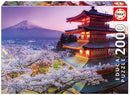 Educa Jigsaw Puzzle featuring Mount Fuji in Japan, showcasing a beautiful pagoda surrounded by cherry blossoms during twilight. The puzzle consists of 2000 pieces, perfect for scenic puzzle lovers.