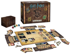 Harry Potter: Hogwarts Battle game by USAopoly, showcasing the game box with a rustic design featuring Hogwarts symbols. The game includes various cards, dice, and tokens displayed on a game board. Ideal for fans of cooperative deck-building games, it accommodates 2-4 players aged 11 and up.