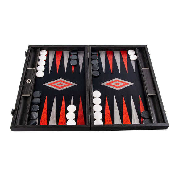 An elegant 19-inch black oak backgammon set with silver accents, featuring a vibrant game board design in red, black, and grey, along with smooth black and white pieces. The set is open, displaying an ongoing game, showcasing its intricate craftsmanship.